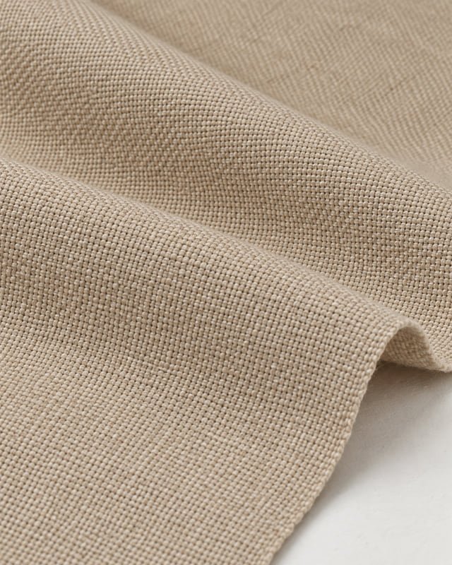 Beige canvas-weave reference Reference illustration of beige fabric with a visible canvas weave and soft folds.