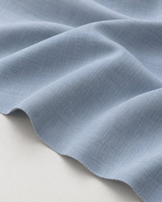 Pale-blue woven fabric reference Reference illustration of pale-blue woven fabric draped in soft folds.
