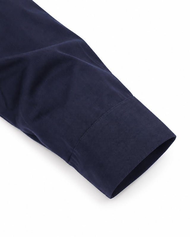 Work shirt cuff edge reference Reference illustration of a plain navy shirt cuff with visible outer stitching and an open sleeve edge.
